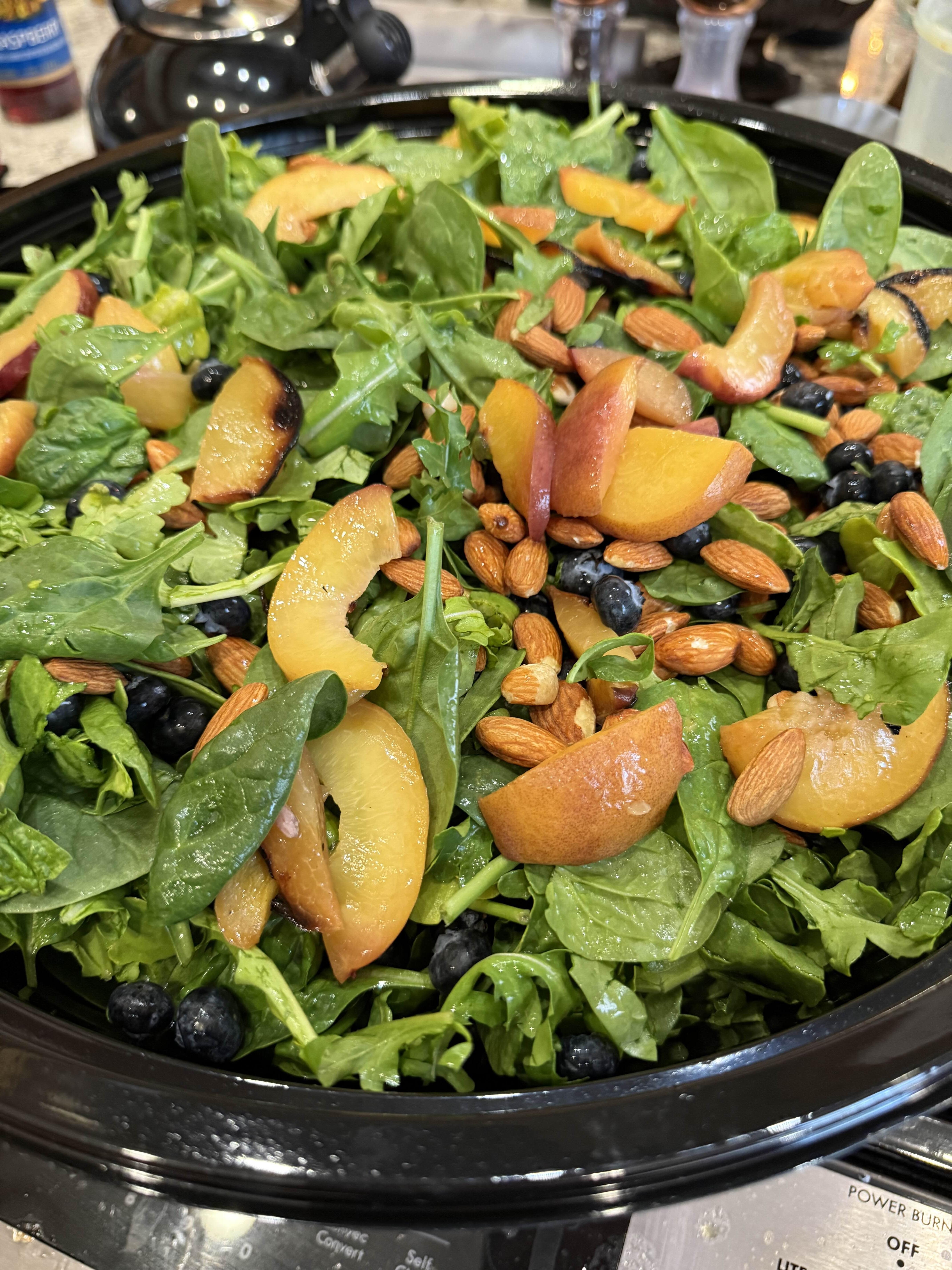 Blueberry peach salad prepared on site