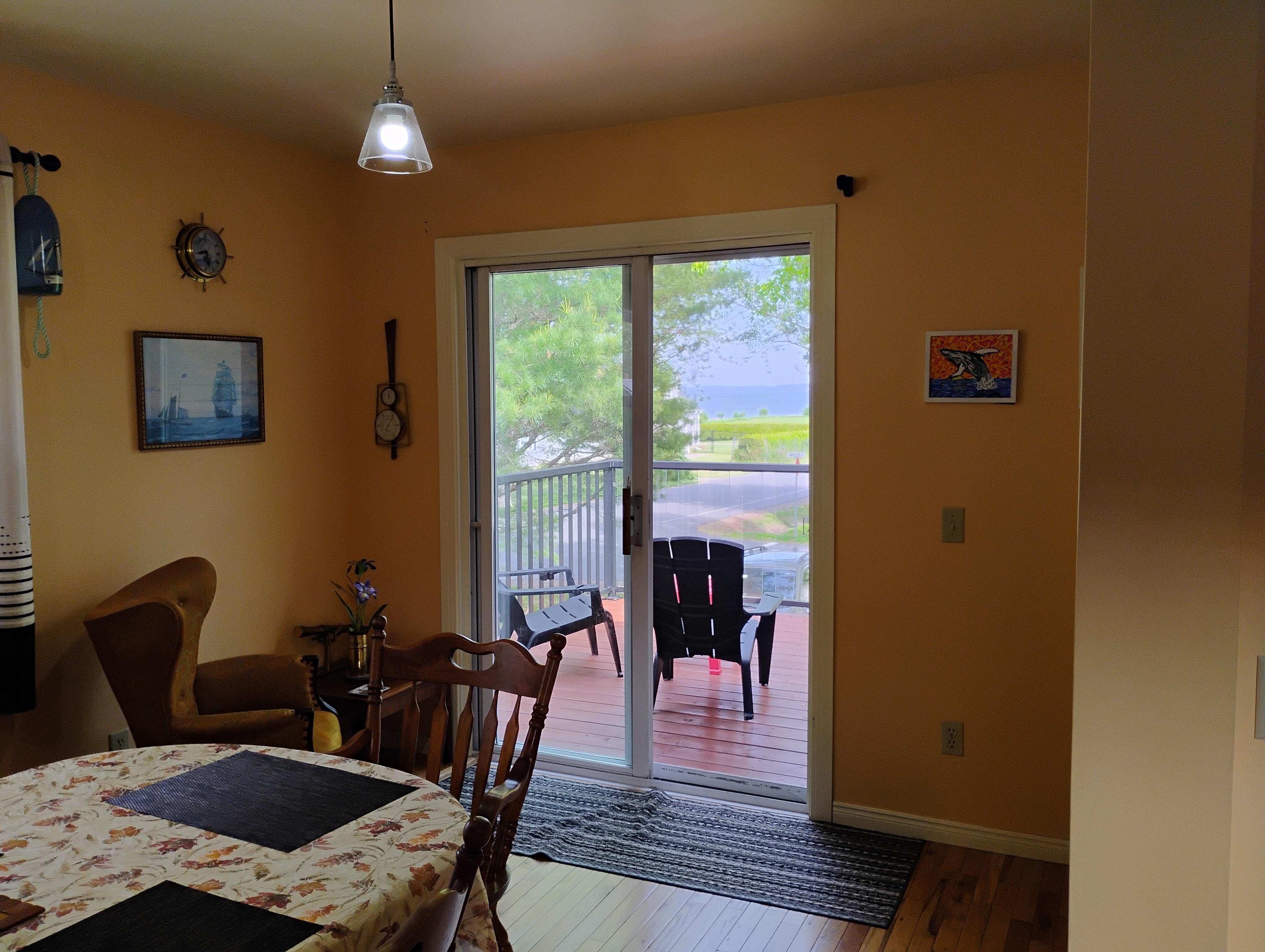Dining room with view out to the deck.