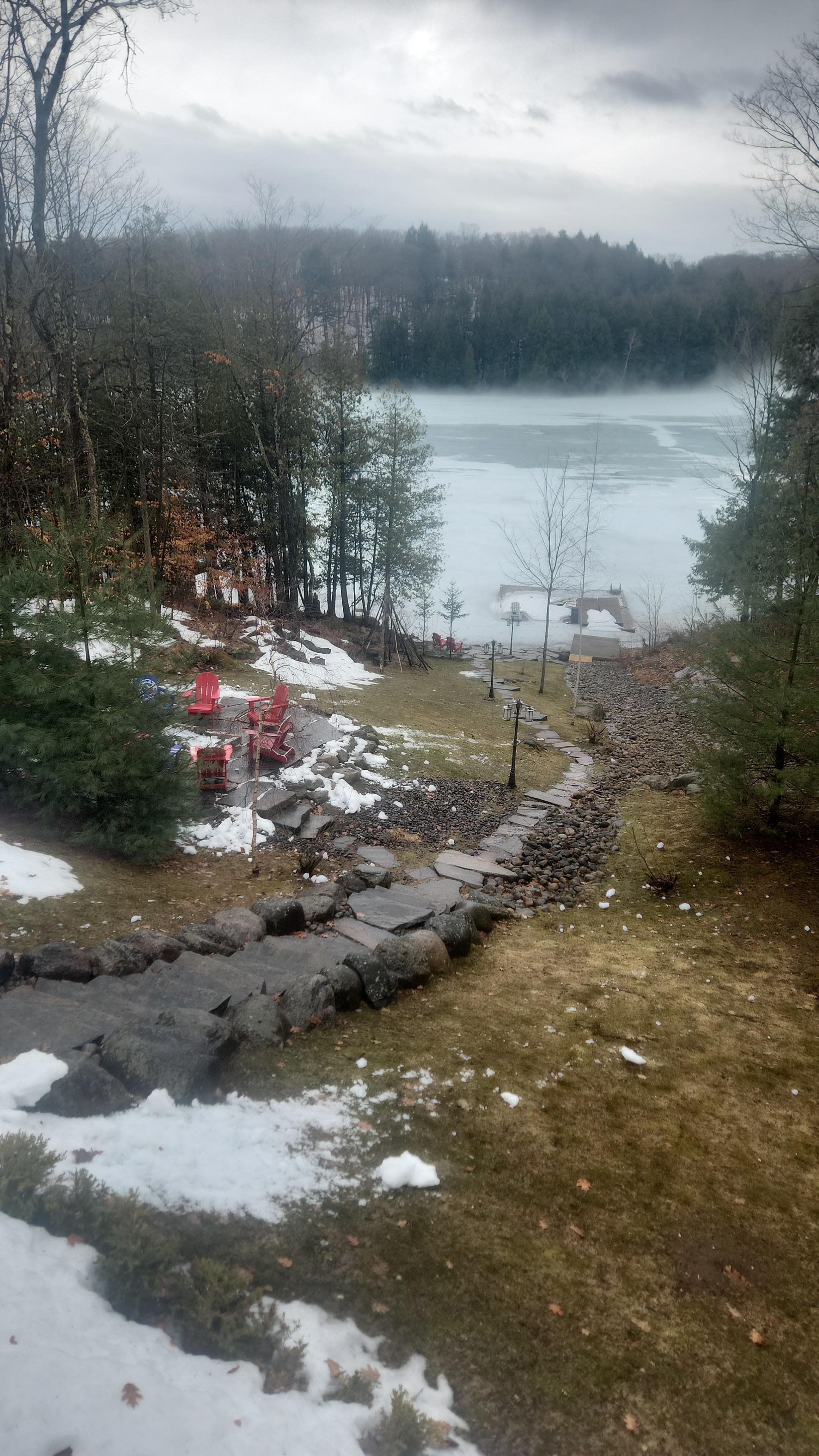 view from deck to lake, nicely landscaped 
