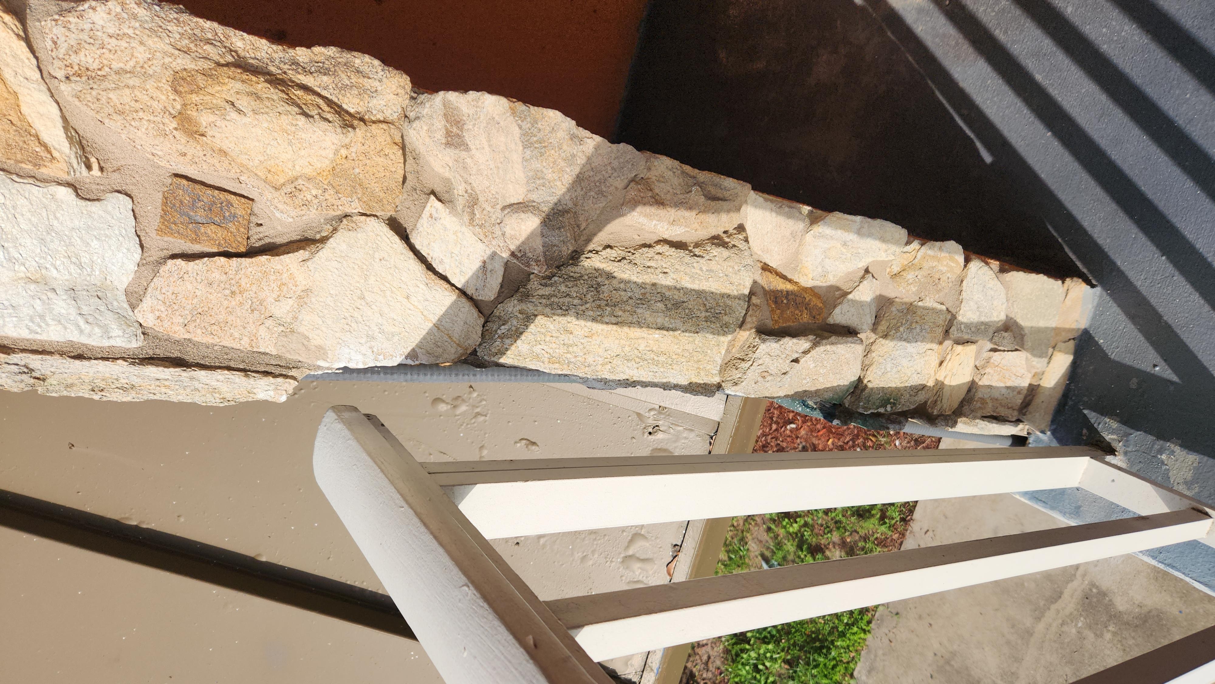 Railing on 2nd floor was not secured to wall. If someone were to lean on it they would fall.