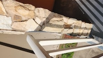 Railing on 2nd floor was not secured to wall. If someone were to lean on it they would fall.