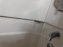 Resurfaced shower was slippery and moldy.