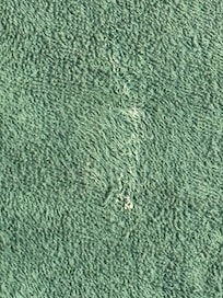 Tooth paste or something on towel