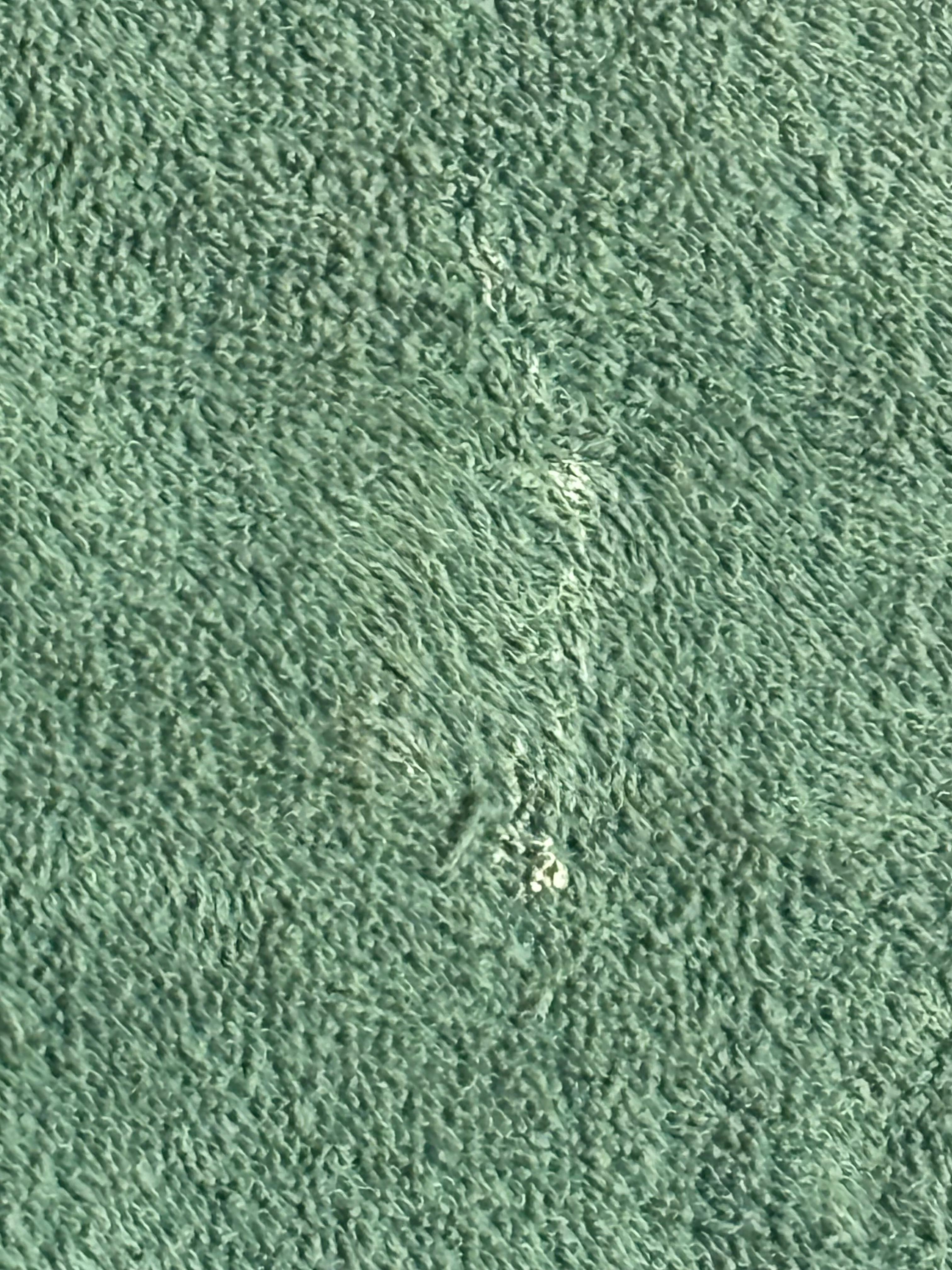 Tooth paste or something on towel