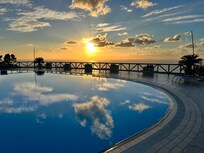 Sister hotels pool with a view.