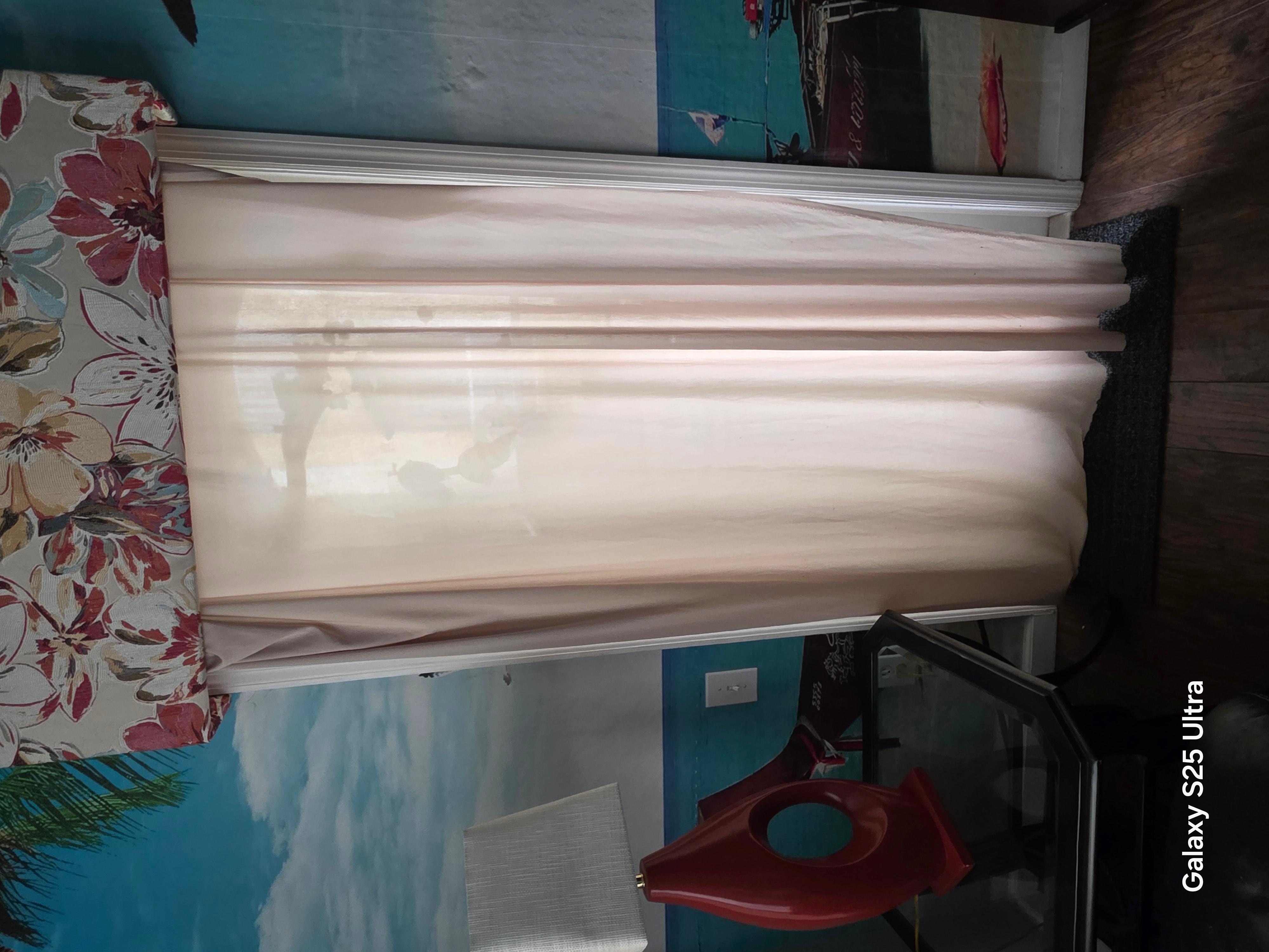 Some kind of cloth hanging at the door. 