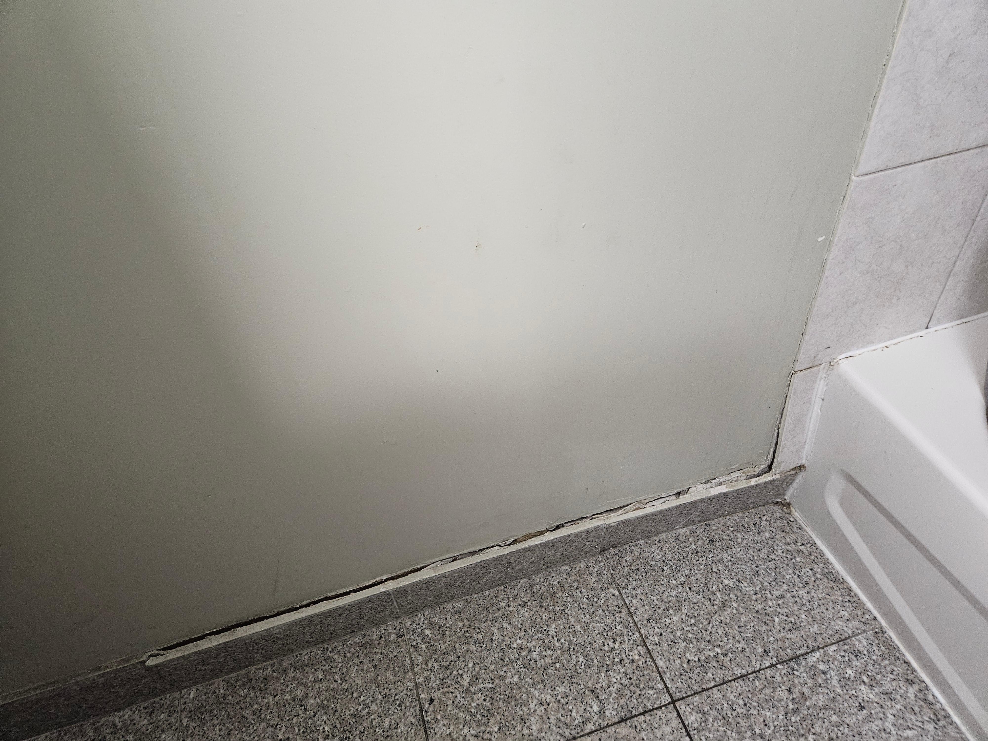 Trim is coming off the wall and all the caulking is gone.