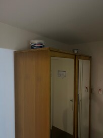 Ink tanks over wardrobe in the room