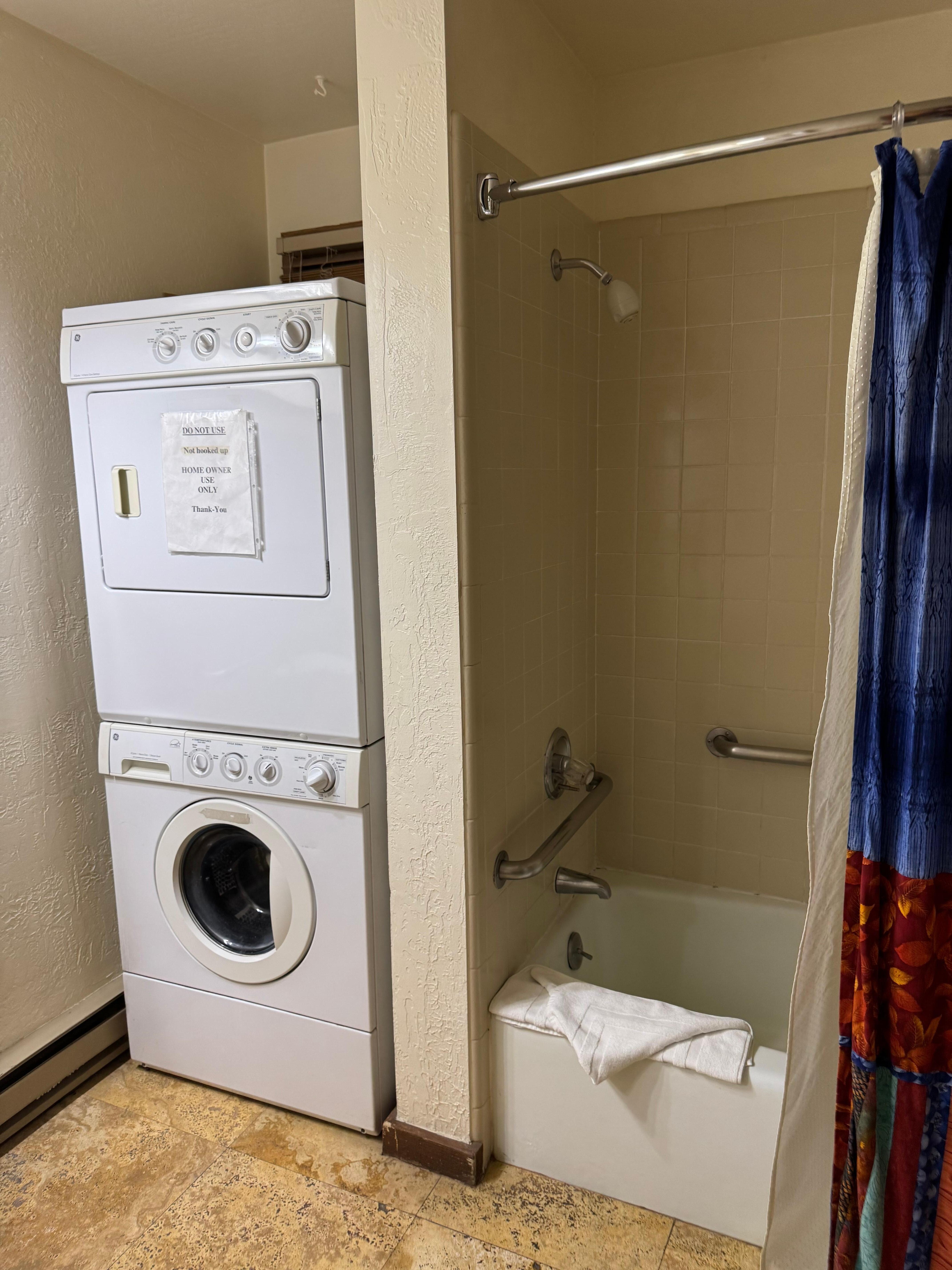 A washer/dryer storage unit? … And our shower.