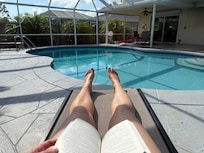 Lounging by the pool with a book in the AM