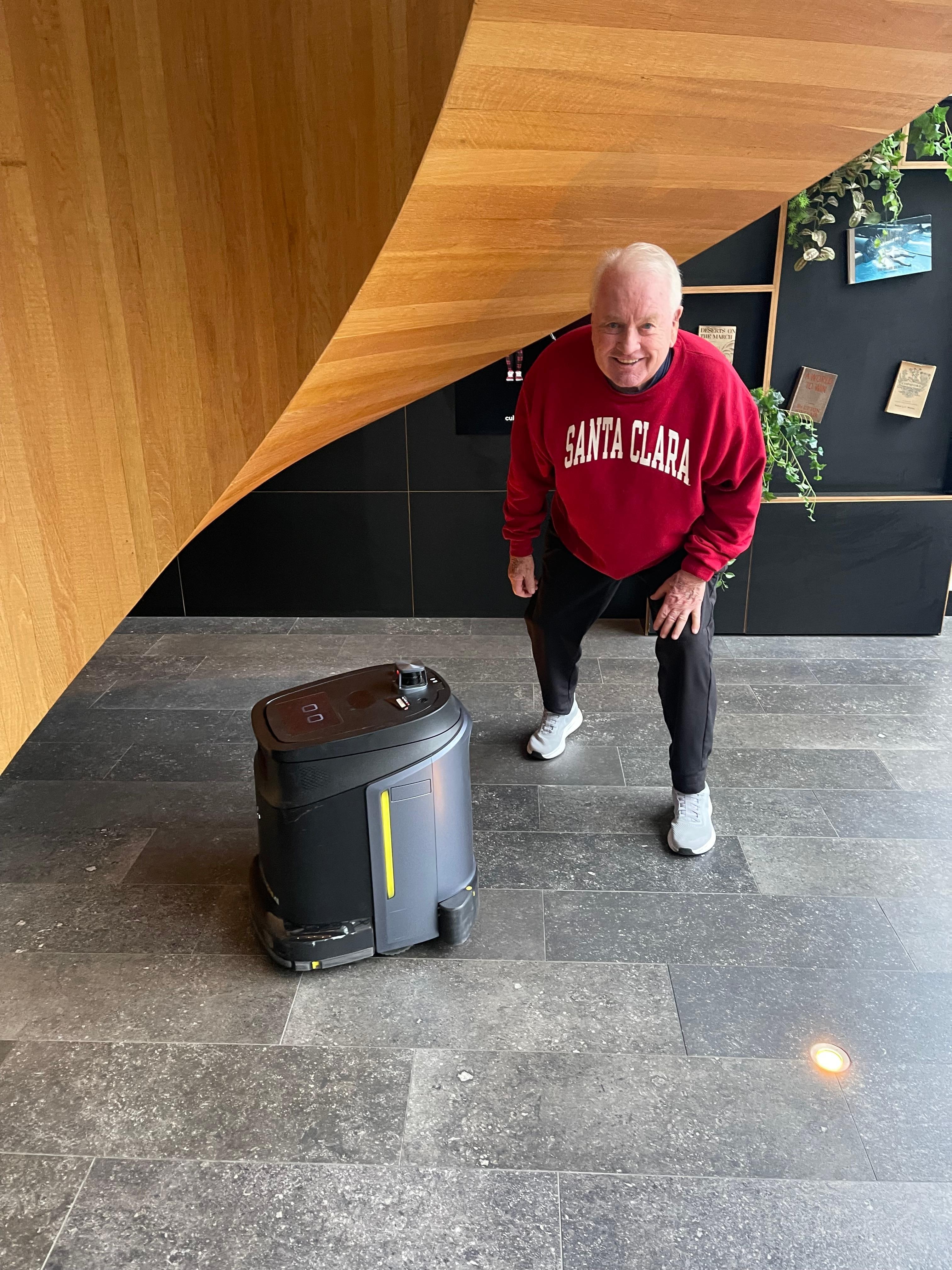 My husband checking out the robot who did a great job of keeping the general areas’ floors clean.
