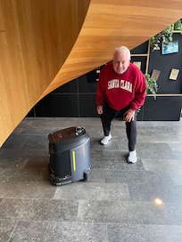 My husband checking out the robot who did a great job of keeping the general areas’ floors clean.
