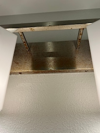 Light fixture in bathroom rusted.