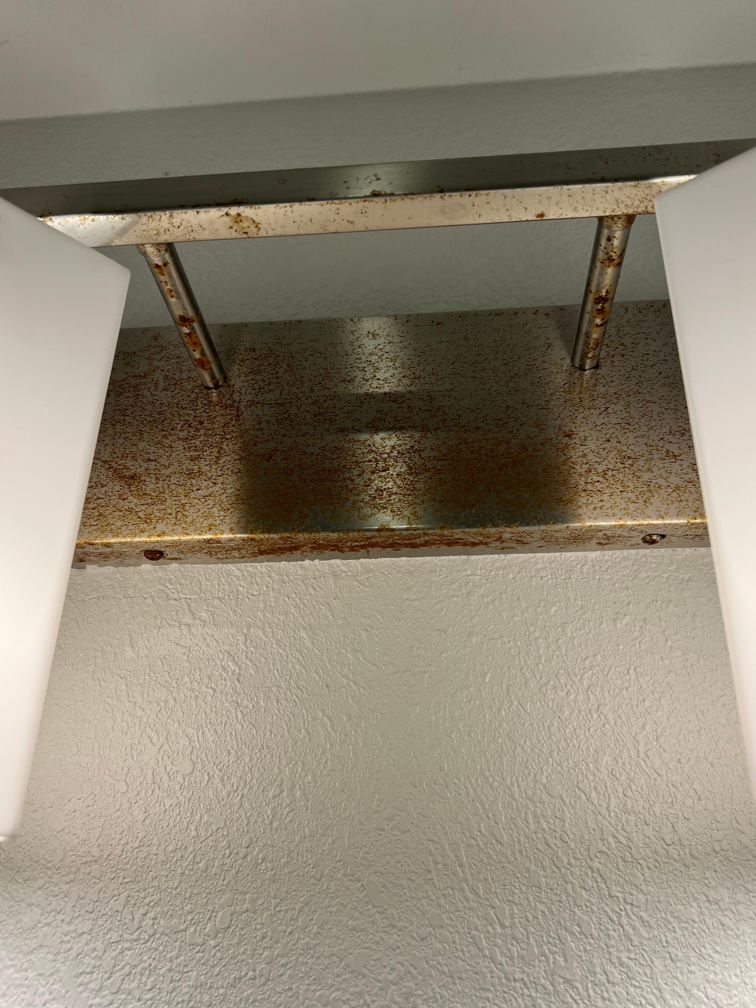 Light fixture in bathroom rusted.