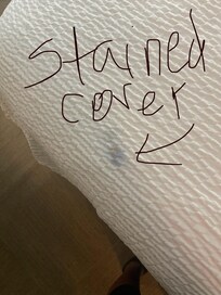 Stained bed coverlet