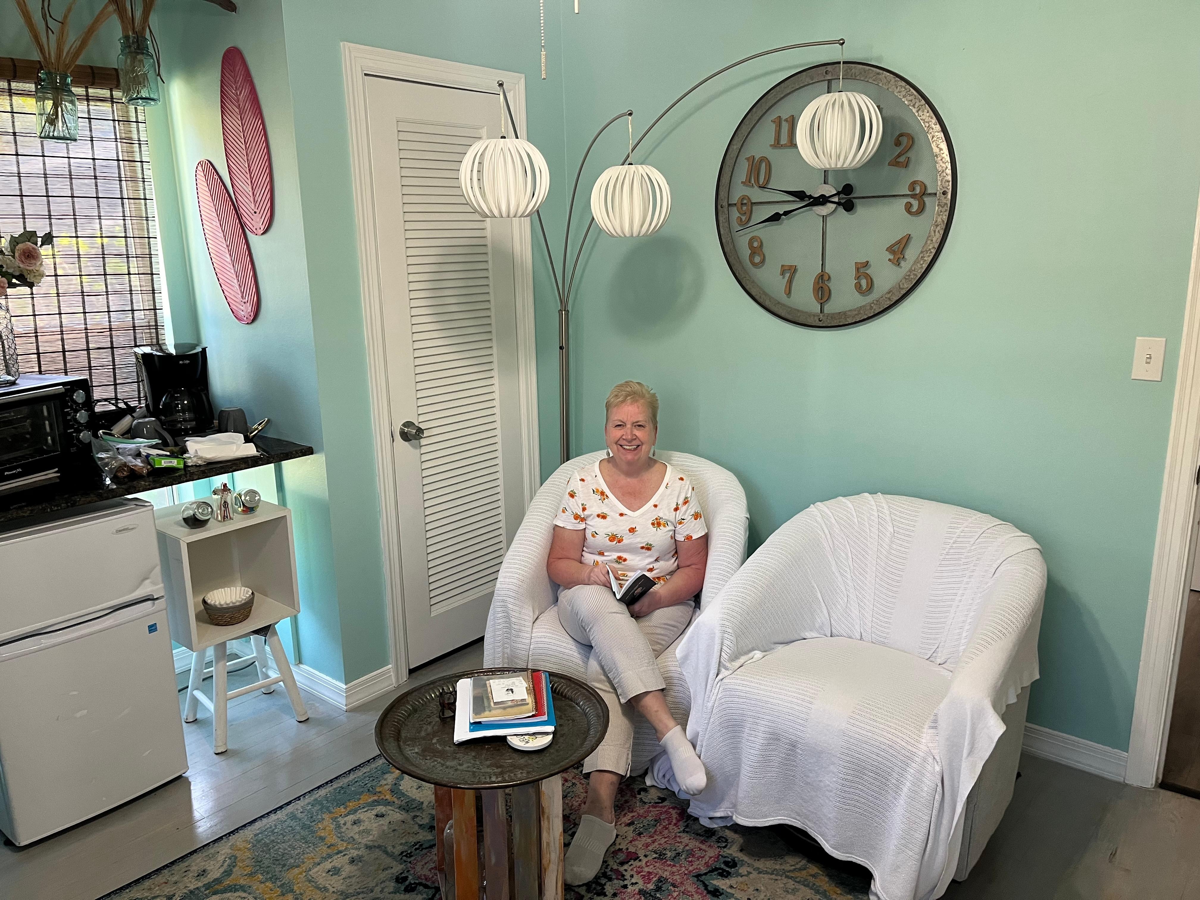 the sitting room with TV, refrigerator   and microwave 