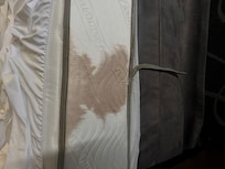 No mattress cover on the bed just a fitted sheet and this was the condition.