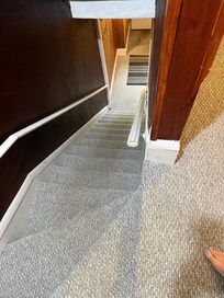 Stairs from the front door to the apartment. Also they are narrow and have a 90 degree angle.