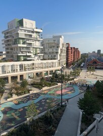 View of plaza and splash pad from third floor deck