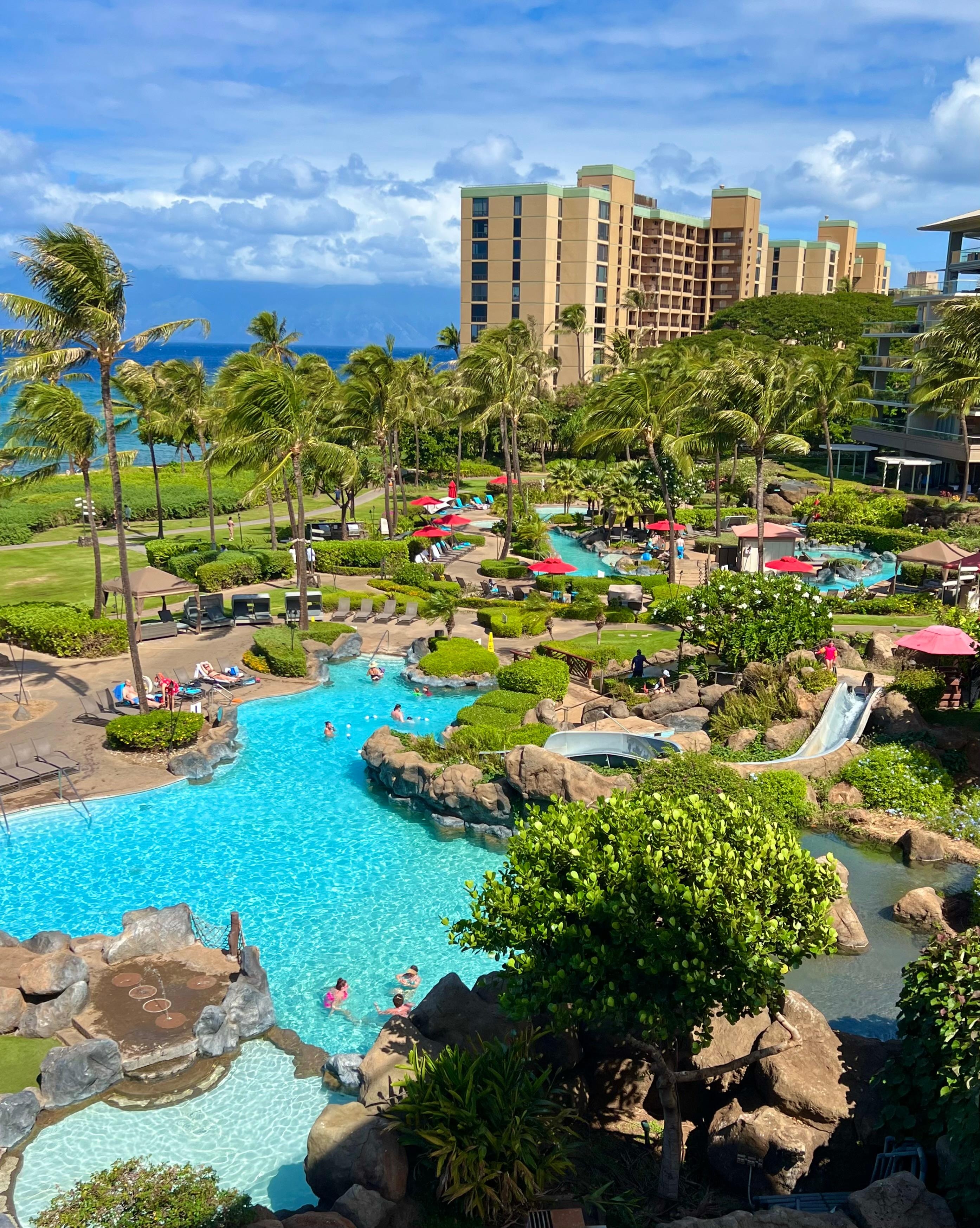 Main pool with slide and grottoes as seen from the balcony 