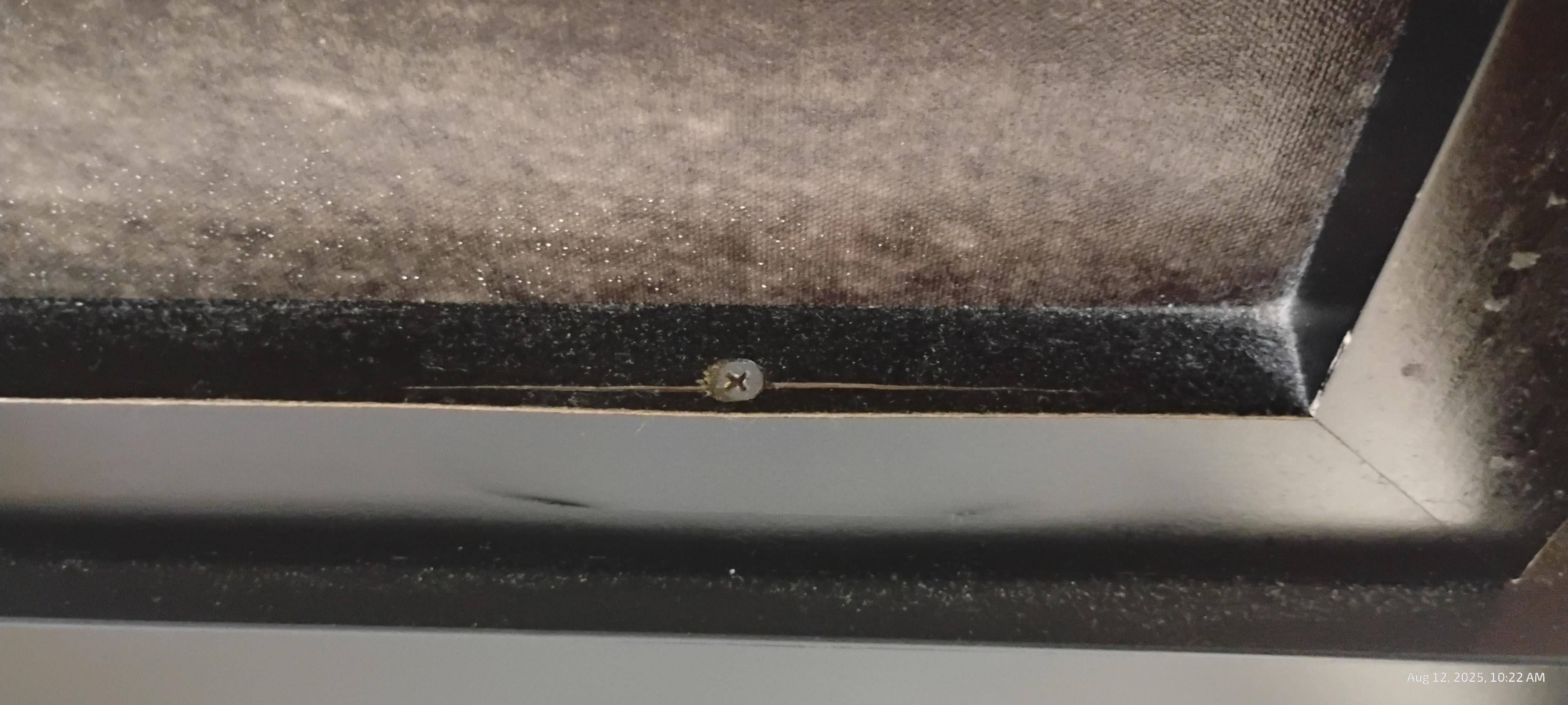 Picture on the wall above the bed lots of dust 