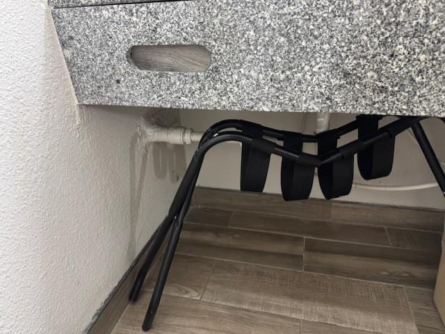 broken luggage cart and piece of cardboard blocking tissue dispenser