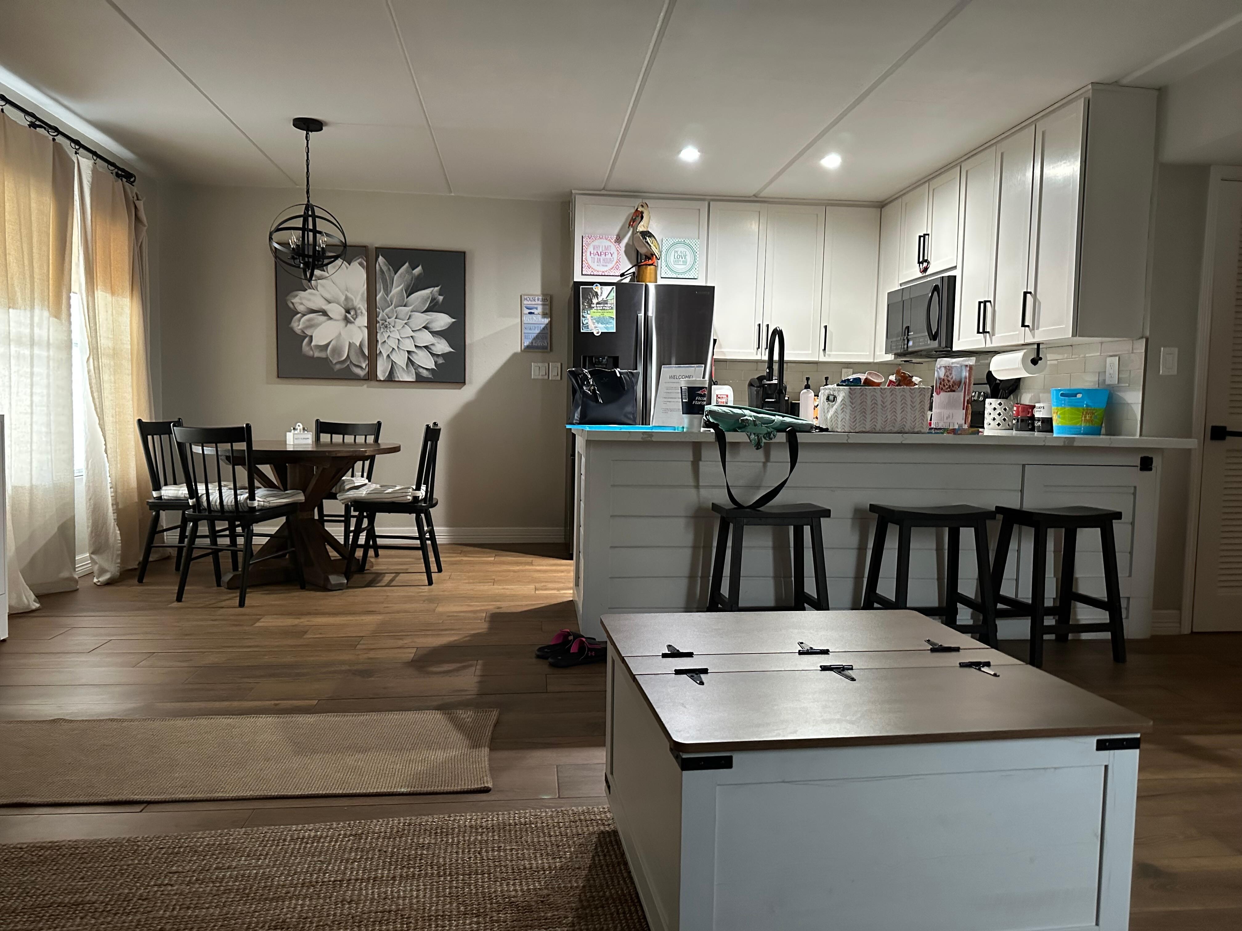 View of kitchen area from sofa.