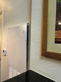 Open metal door in the living room