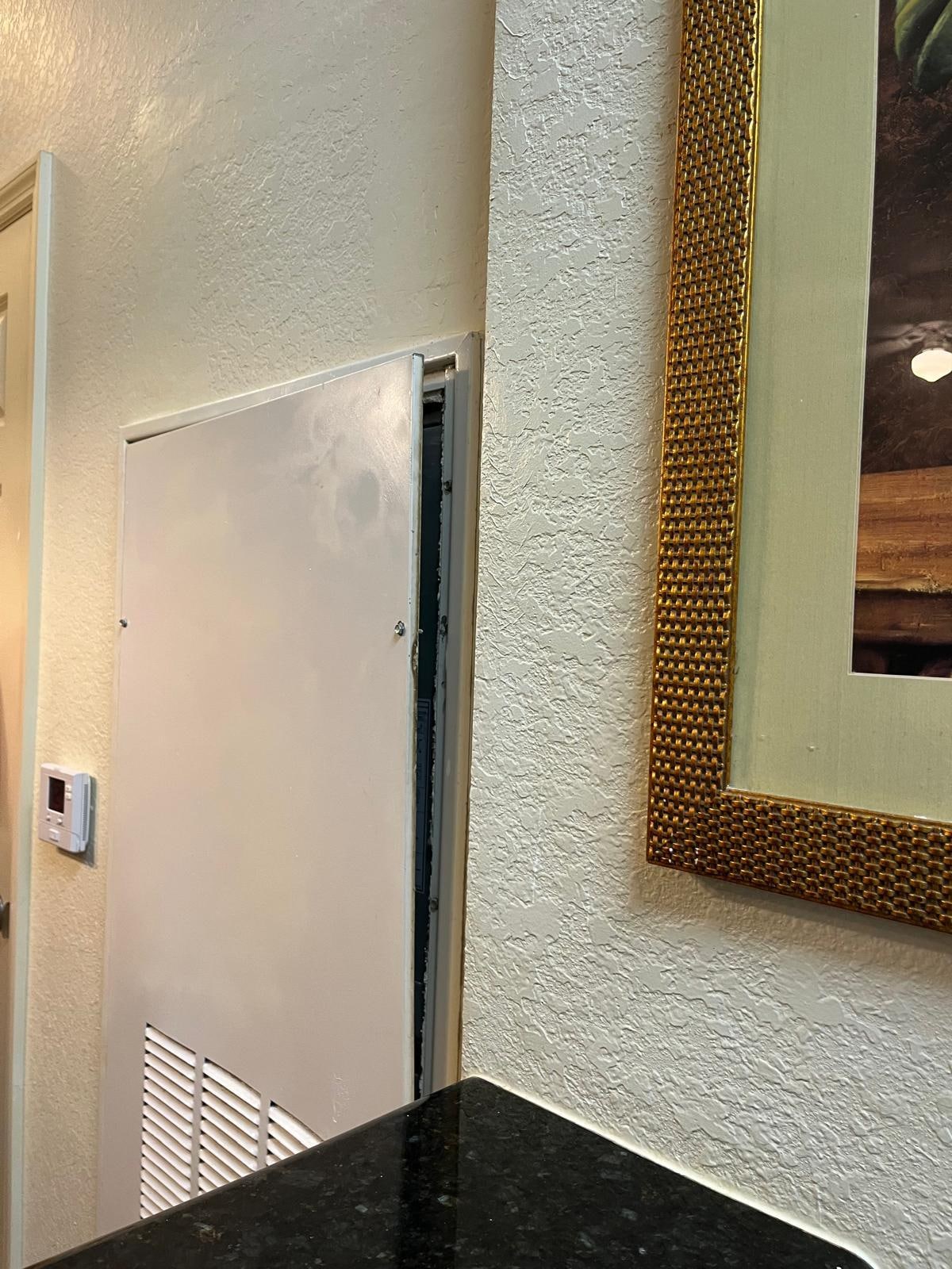 Open metal door in the living room