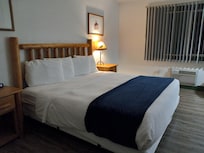 Single king room with view of - empty lot with debris. But sunrise view was decent.