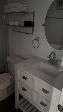 Bathroom with all amenities(towels, toilet paper, soap, hairdryer)