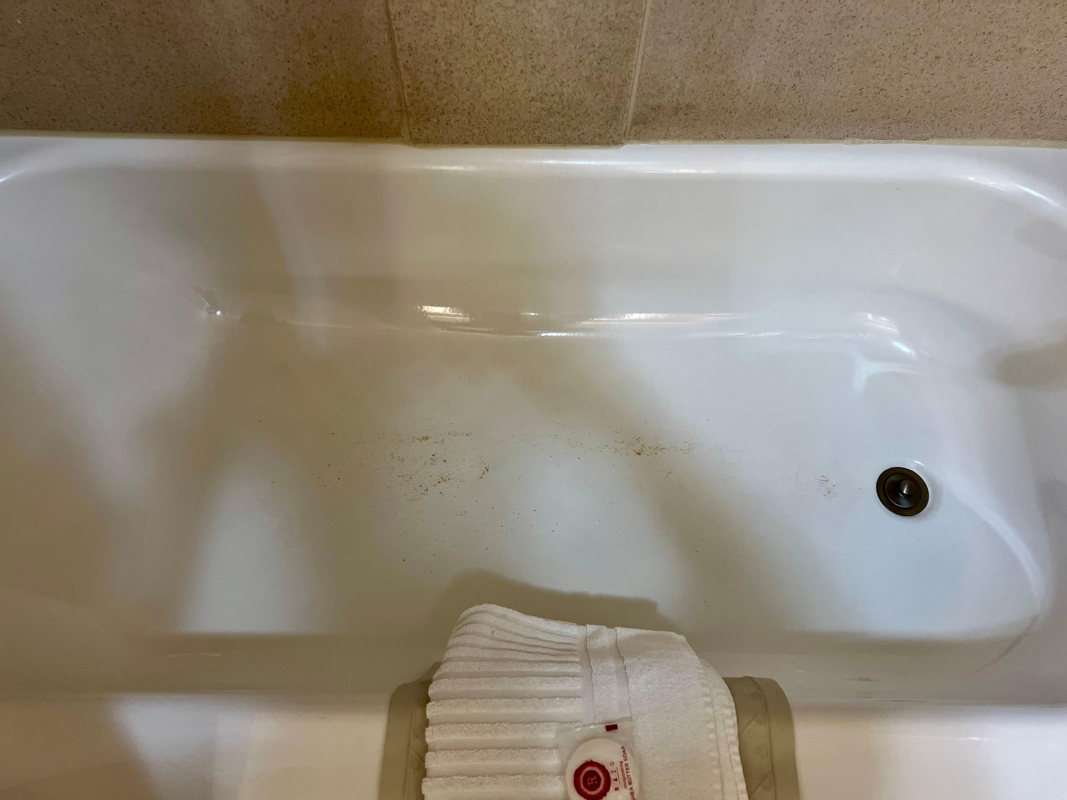 This was the bathtub with caked-on dirt and grime around the edge