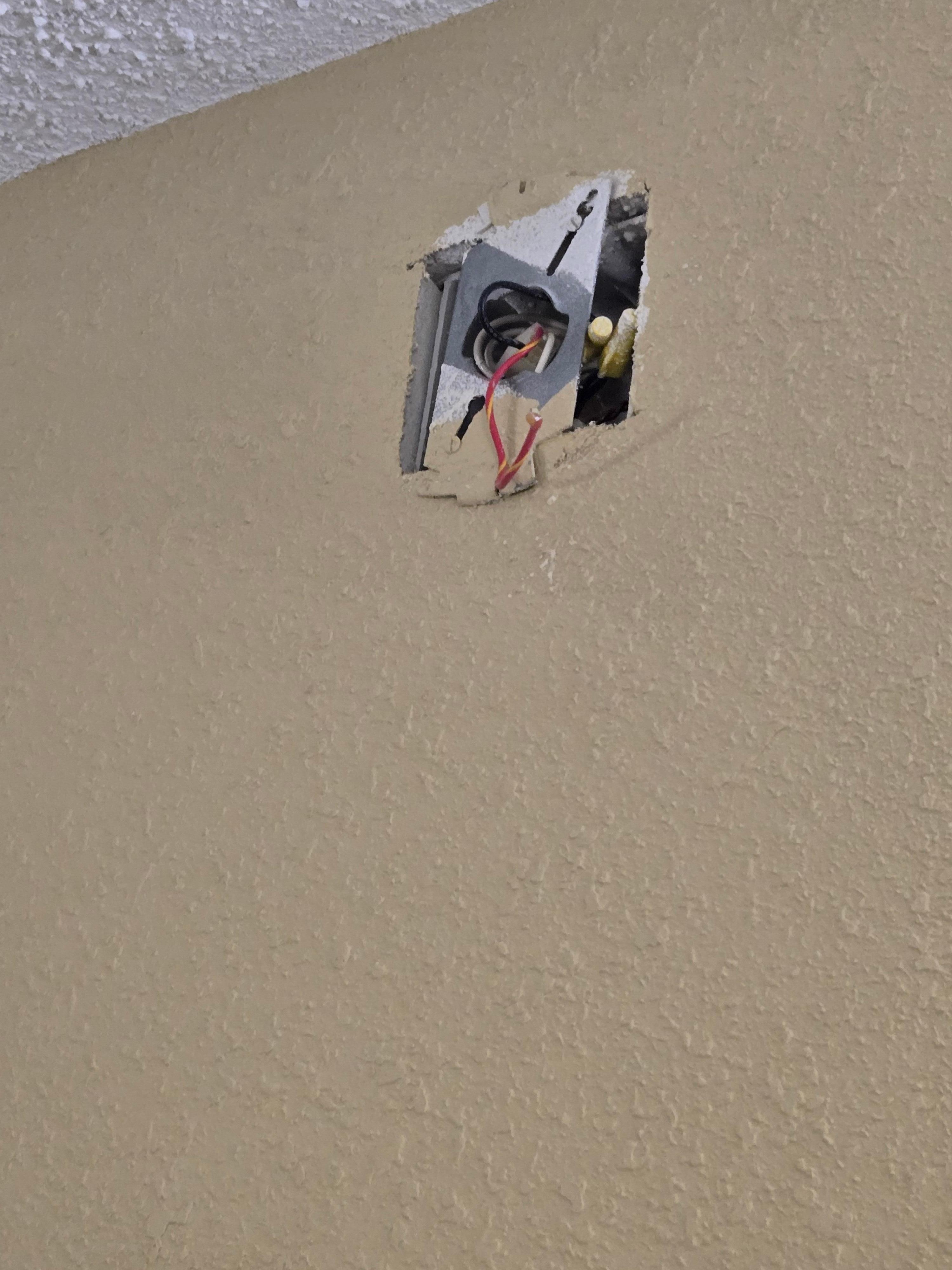 Looks like the smoke alarm was ripped out of the wall