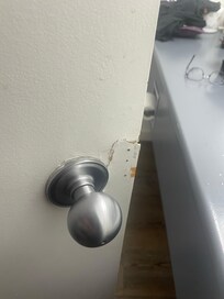 Looks like someone tried to break into the bathroom, and was not repaired.