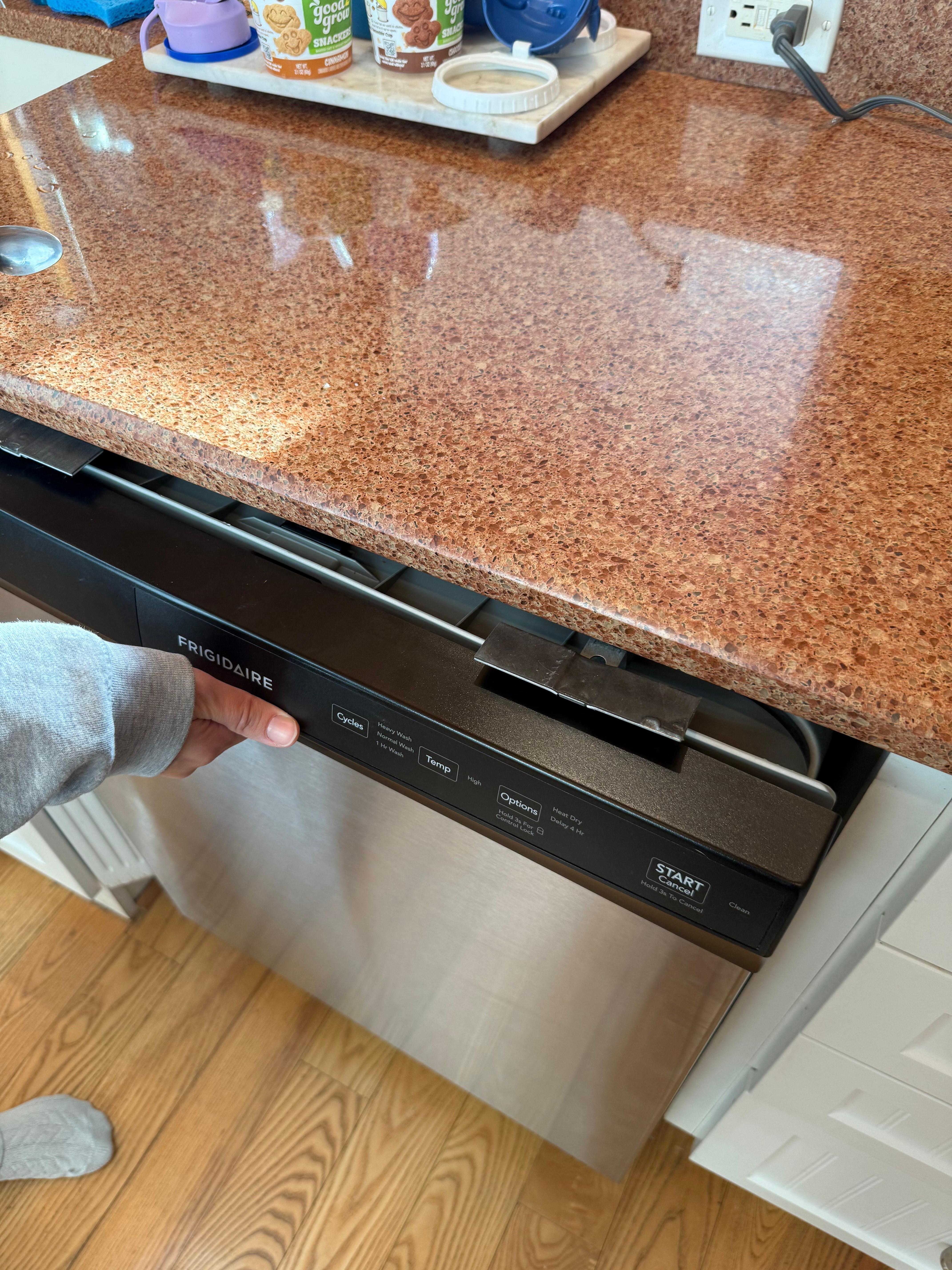 Dishwasher not properly installed/attached. Safety hazard.