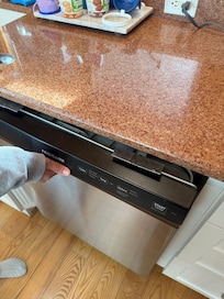 Dishwasher not properly installed/attached. Safety hazard.