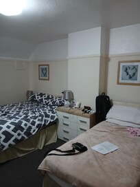 Spacious comfortable bedroom with everything in you could ever need