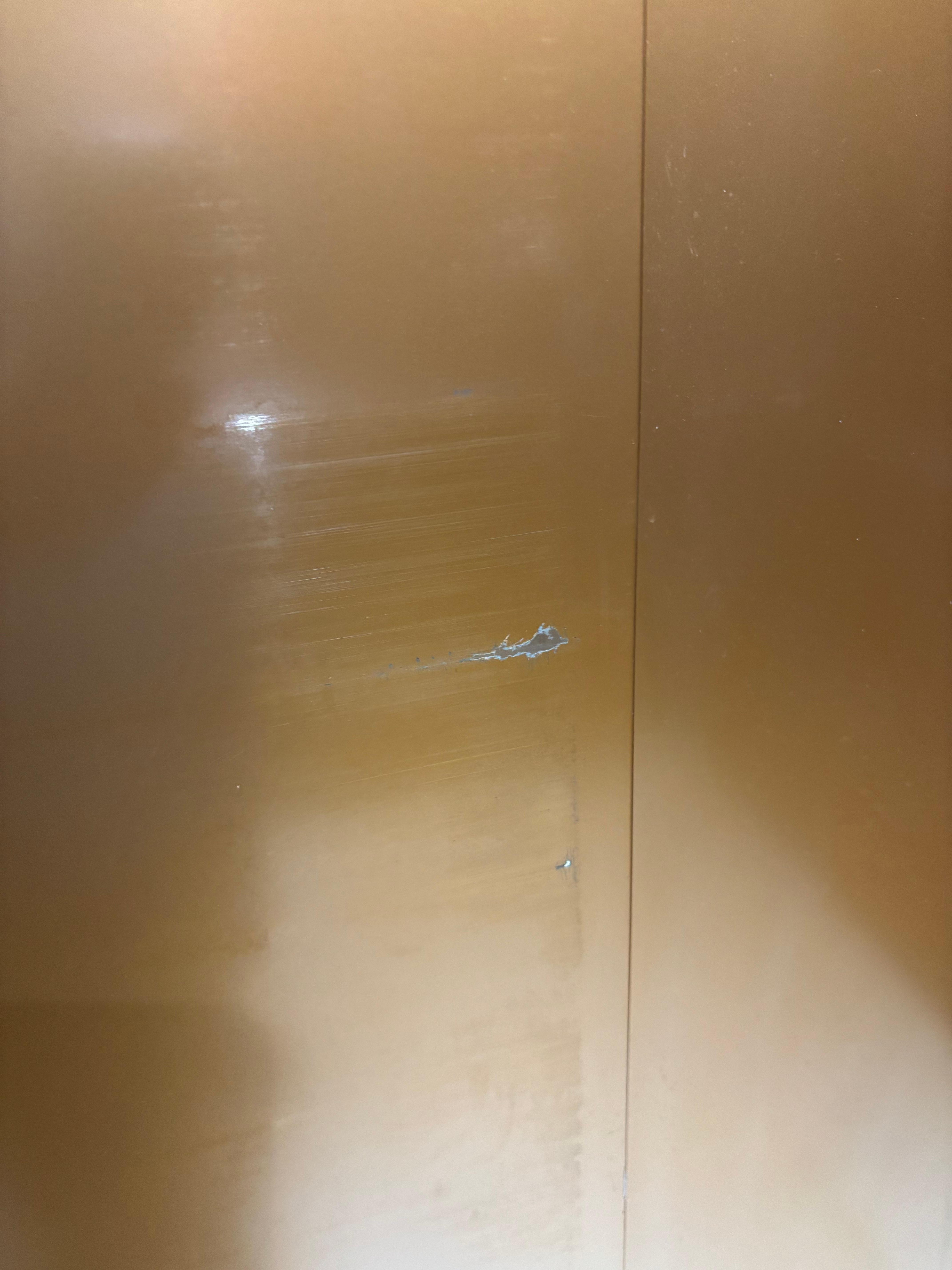 The elevator doors are scratched 