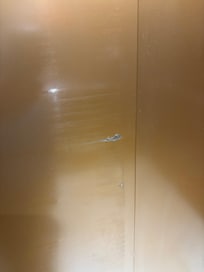 The elevator doors are scratched