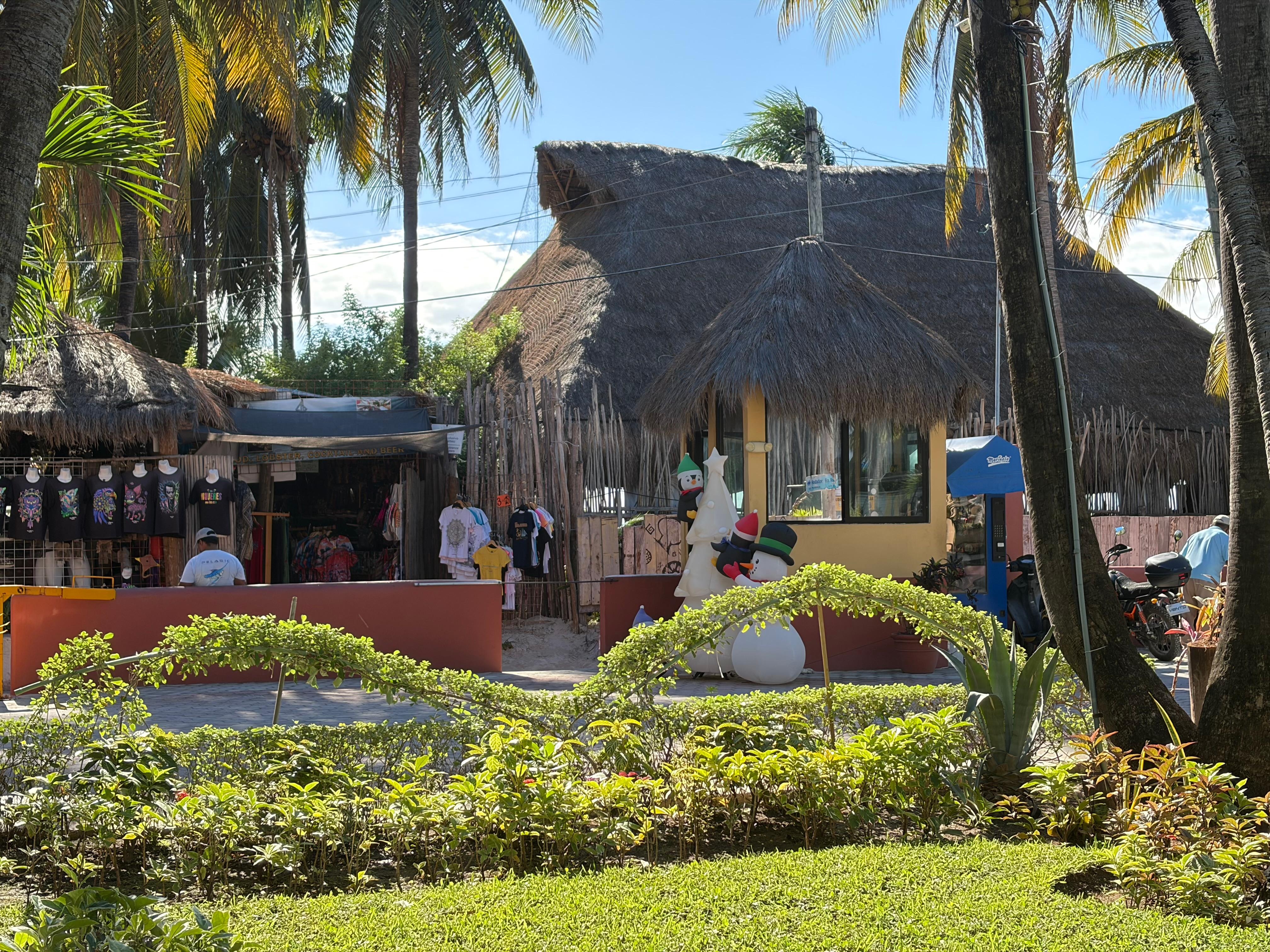 entrance with security and small farmacia across road