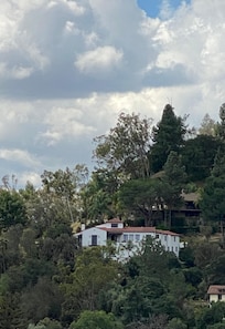 View of house from historic Pasadena. It’s in the hills above Arroyo Park