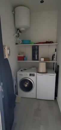 Laundry area...with washer and freezer!! LOL!