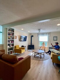 The living room with books of all genres on the book shelf