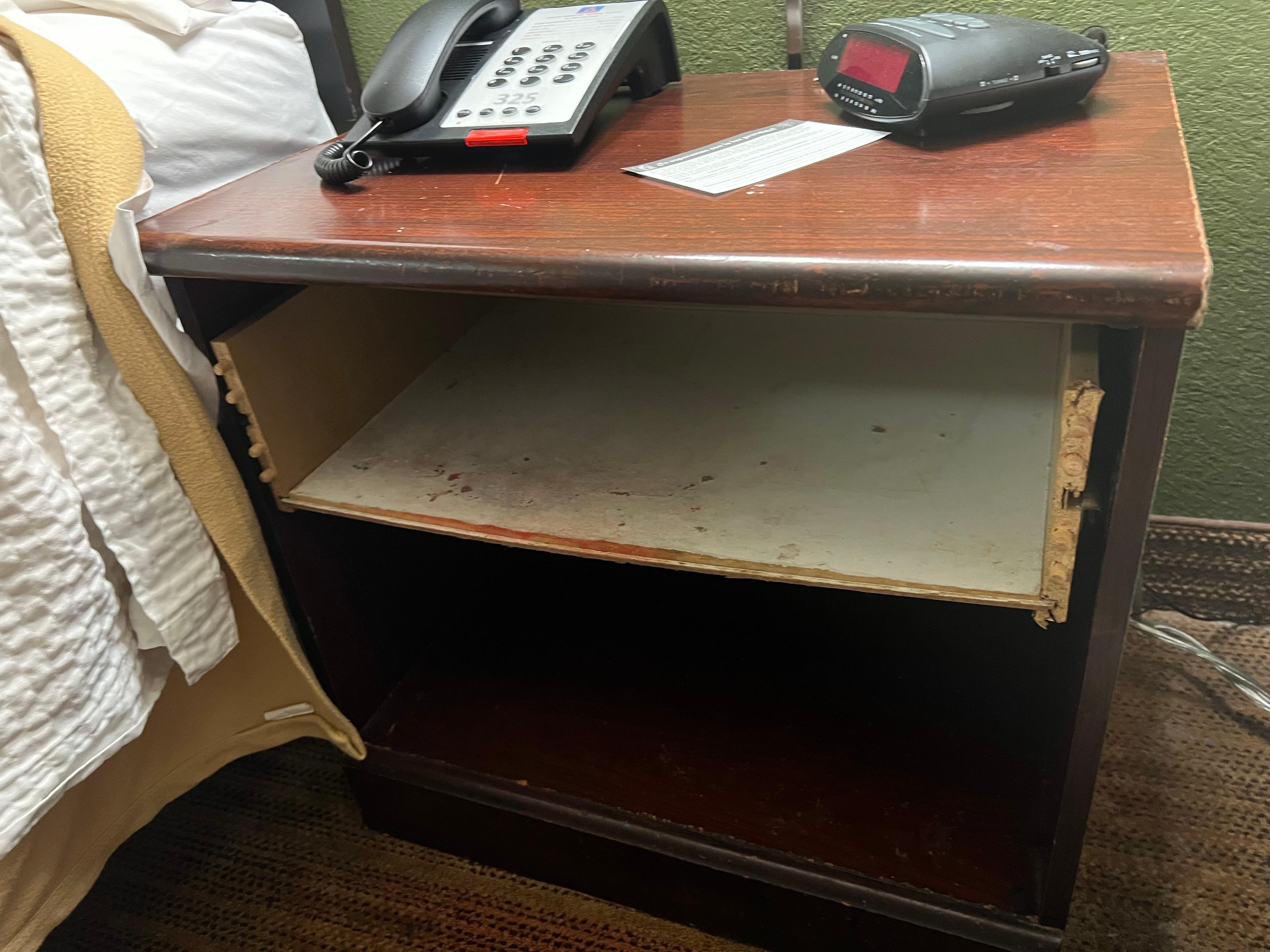 Night stand in first room that was so dirty I just could not even take more pics too nasty would not recommend this hotel to anyone 