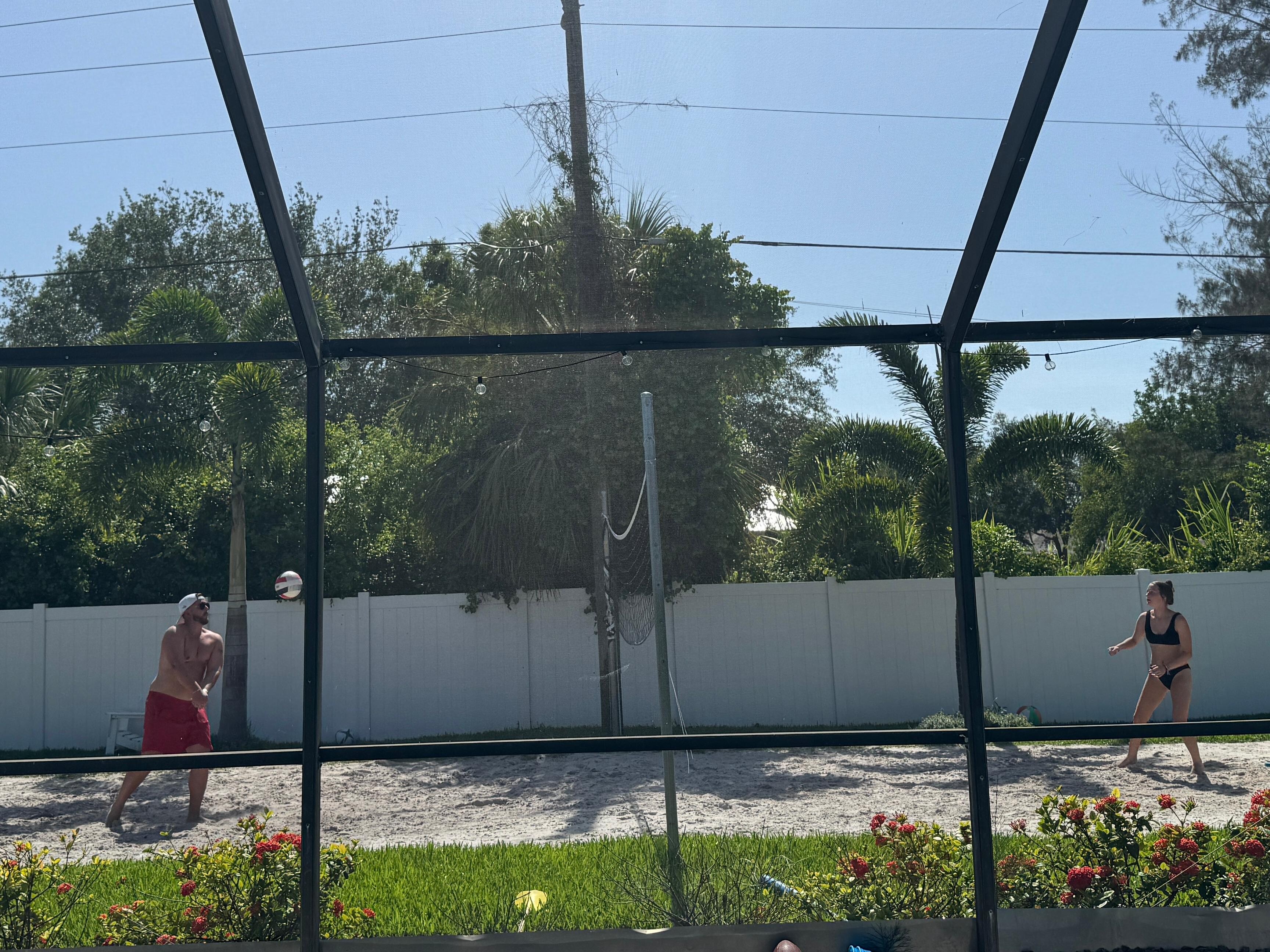Enjoying the pool and volleyball court