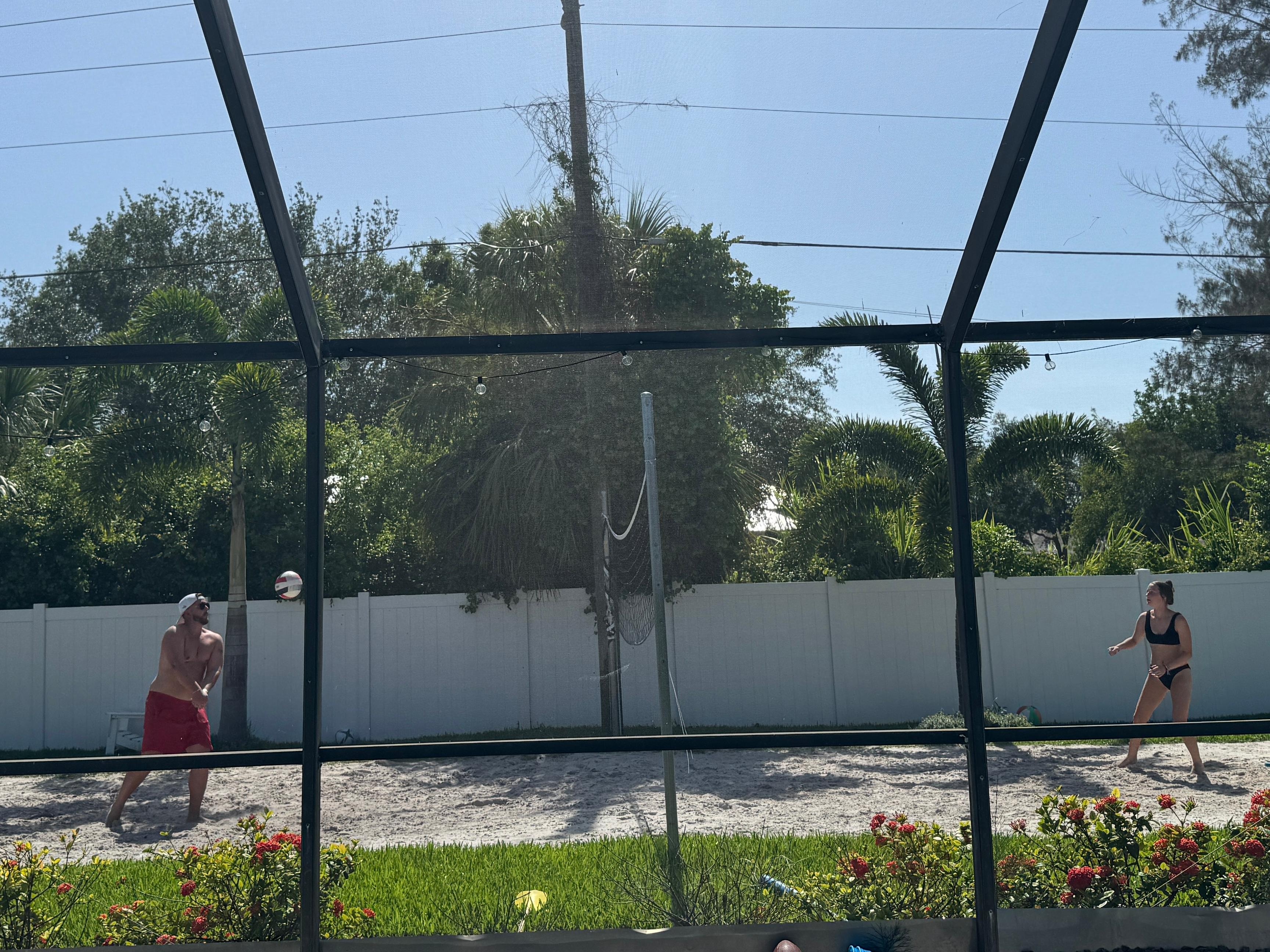 Enjoying the pool and volleyball court
