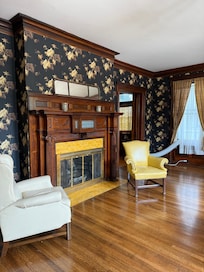 Every room has a different fireplace. So wonderful! Pocket doors can be closed to separate the kitchen from the huge dining room and the living room.
