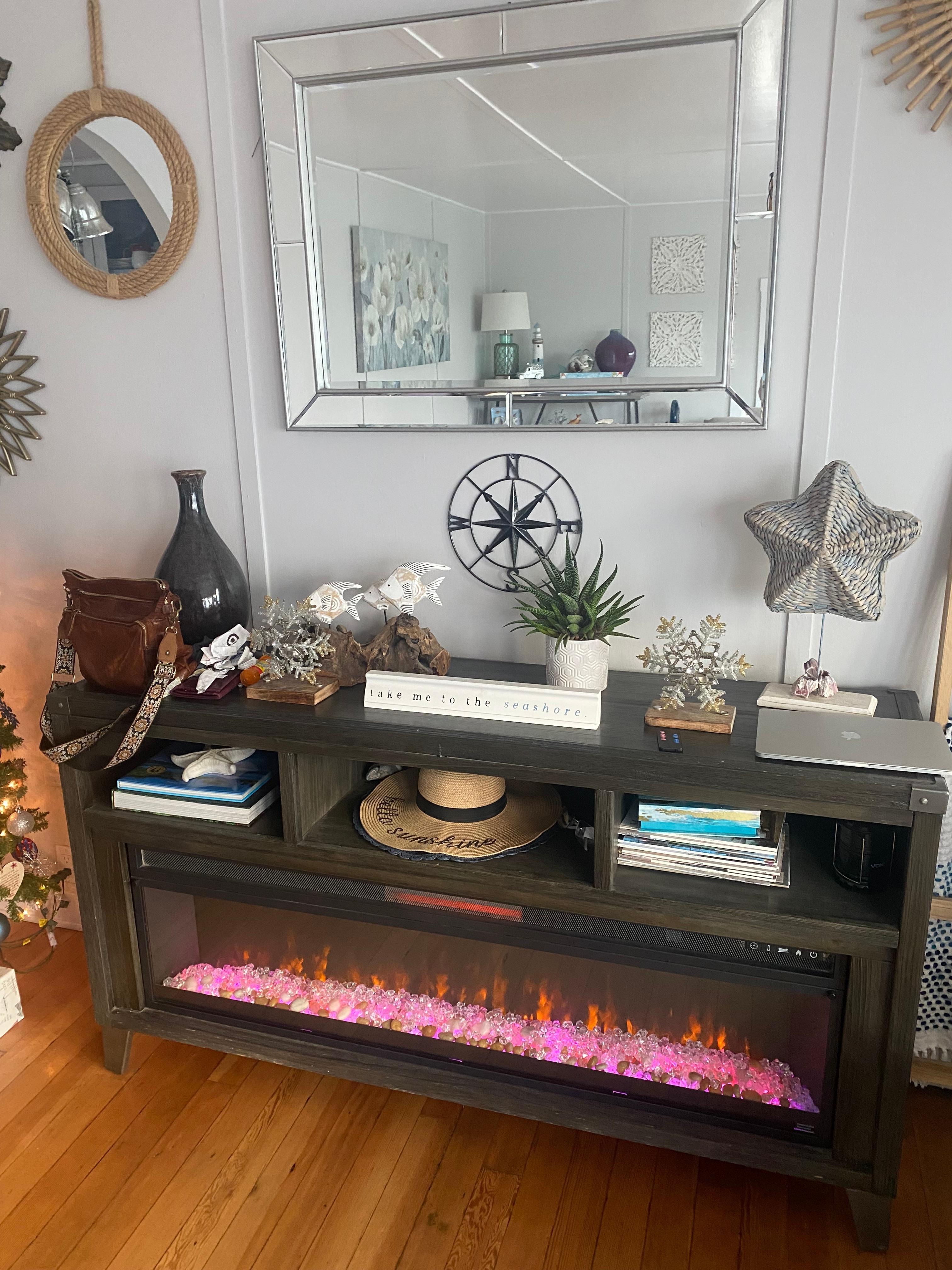 Living room area w/ electric fireplace