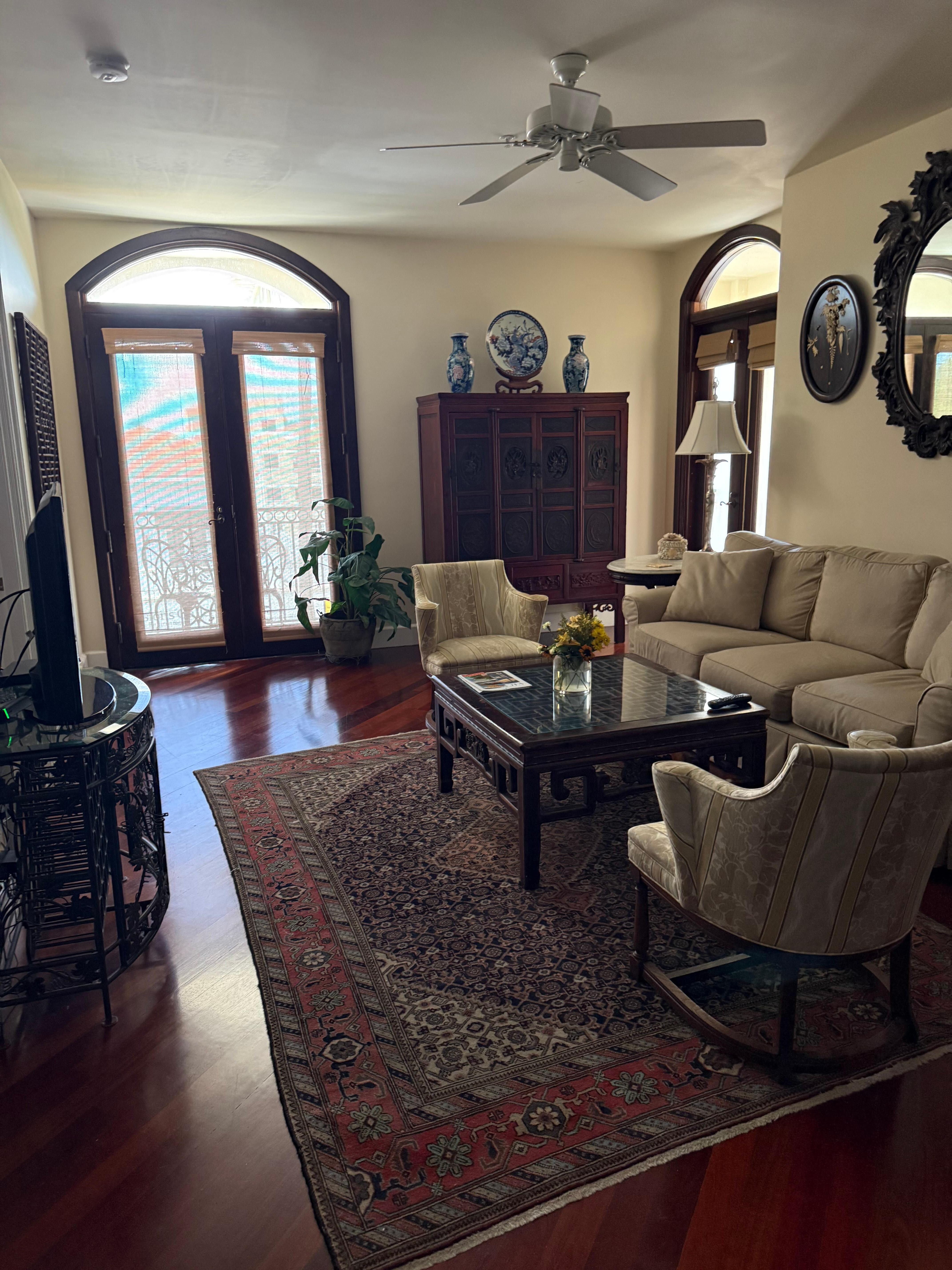 Main living are with doors to balcony with view of Fifth Avenue 