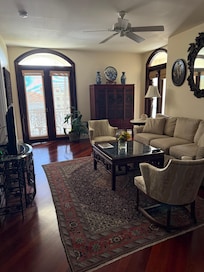 Main living are with doors to balcony with view of Fifth Avenue